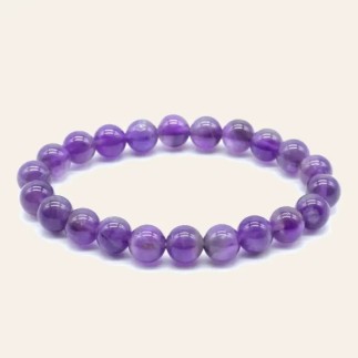 Bracelet en améthyste aux nuances violettes, avec perles rondes de 8 mm.